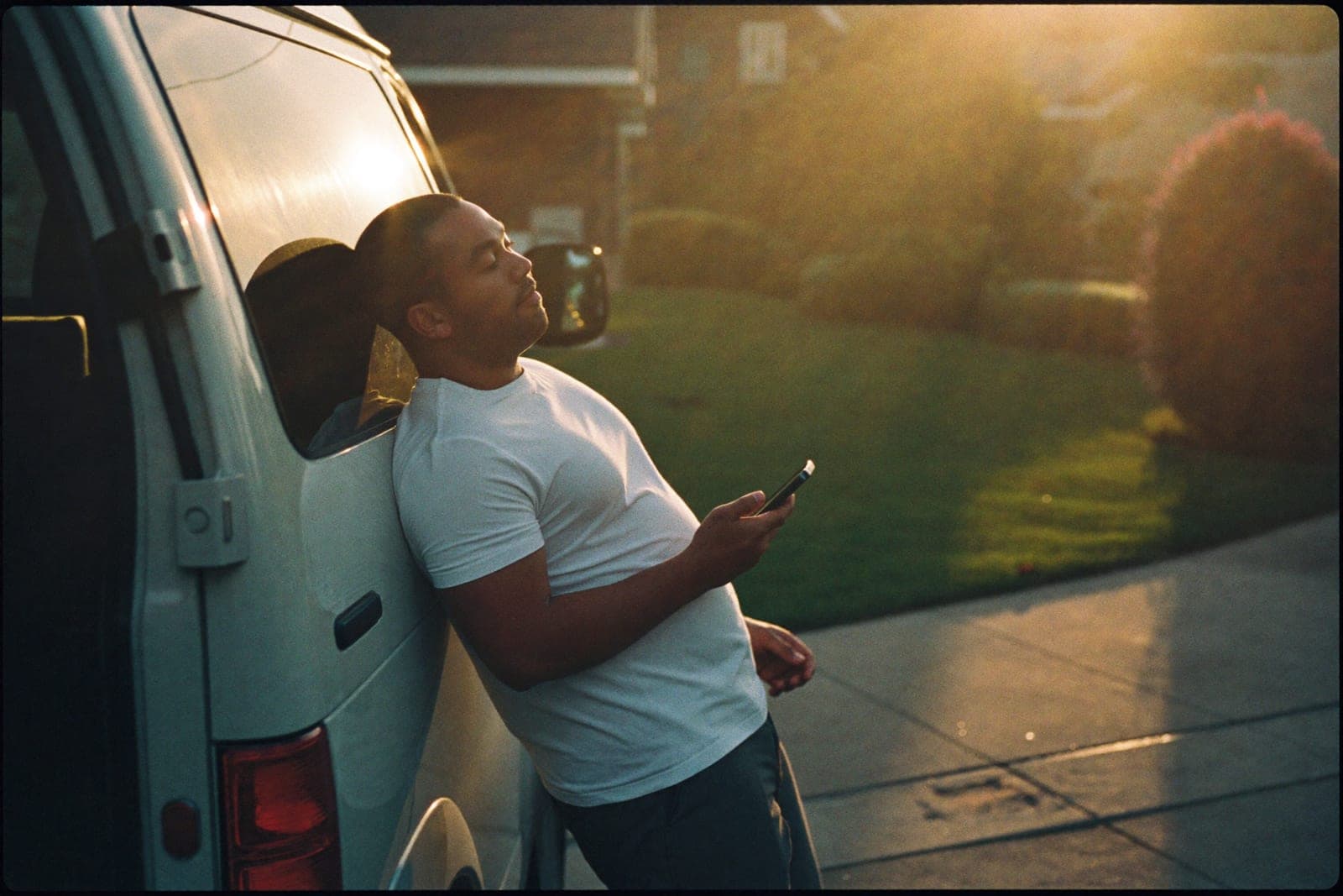 A local home-service owner checking his phone at golden hour