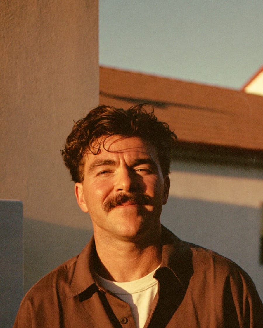 An electrician at a residential job at golden hour